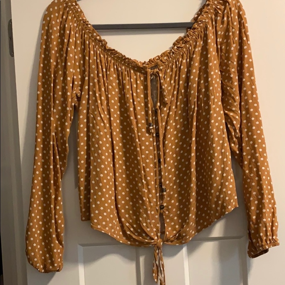 Off-the-shoulder polka dot blouse